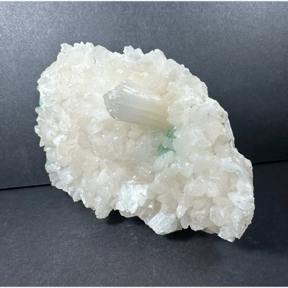 Ocean green apophyllite with stilbite: translucent white crystal cluster and clear quartz point