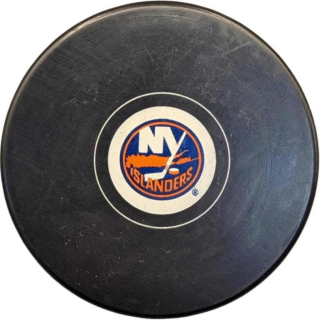 Official New York Islanders licensed black hockey puck with orange stick