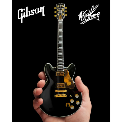 Black Gibson Les Paul guitar model with gold hardware by Axe Heaven®