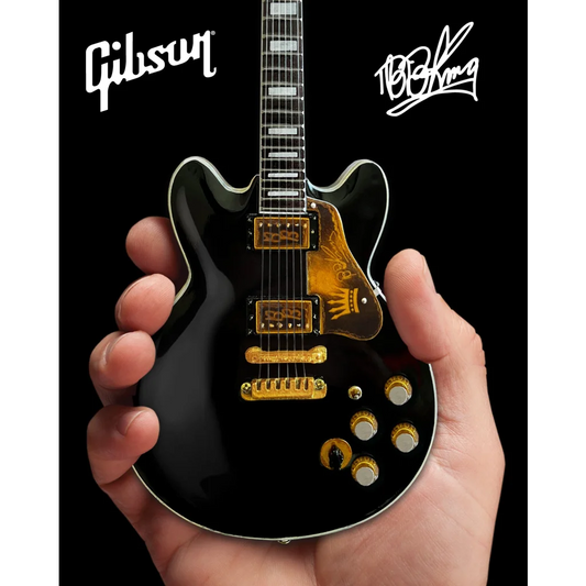 Black Gibson Les Paul guitar model with gold hardware by Axe Heaven®