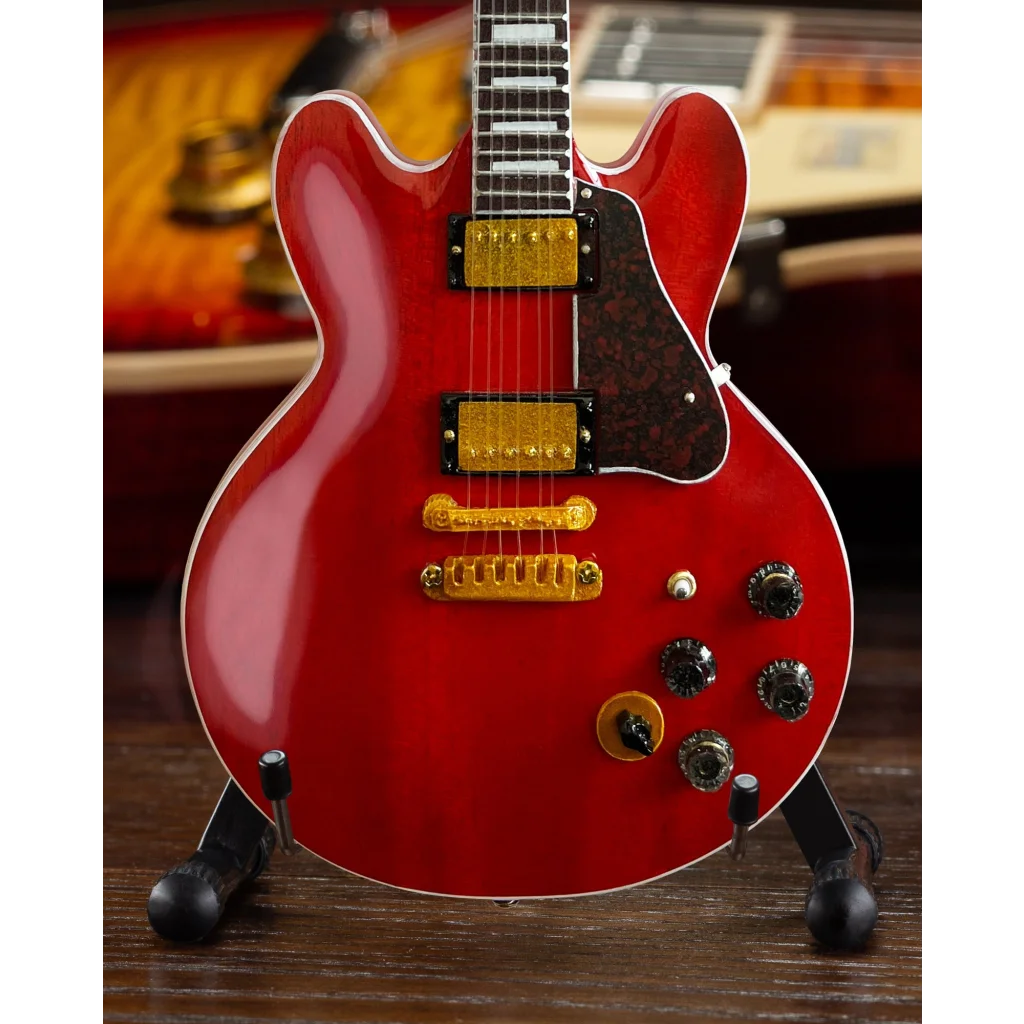 Red Gibson Les Paul guitar model with gold hardware by Axe Heaven®