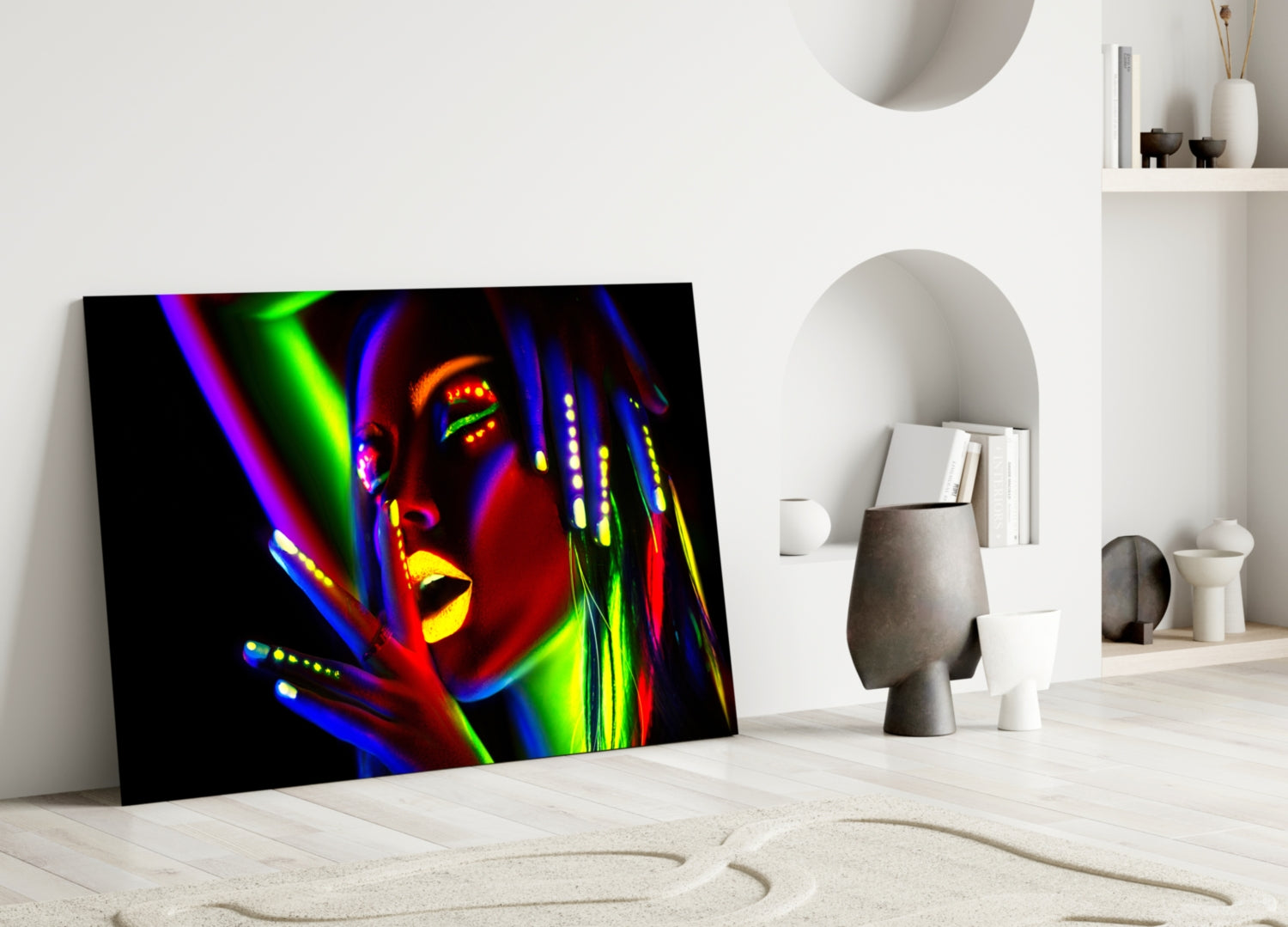 Neon-lit female portrait glass art leaning against white wall in minimalist interior setting.