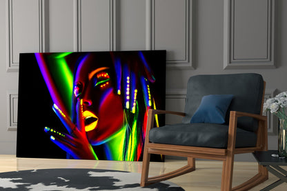 Neon-lit female portrait glass wall art displaying vibrant multicolored light effects displayed in modern living room setting.