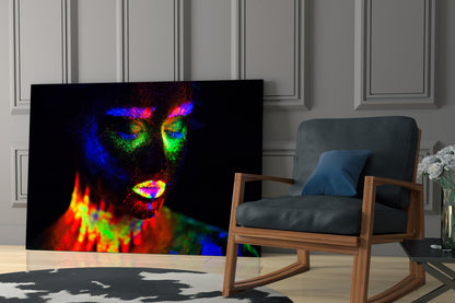 Vibrant neon portrait glass art displaying colorful thermal imaging of a woman's face against black background, displayed in modern living room setting.