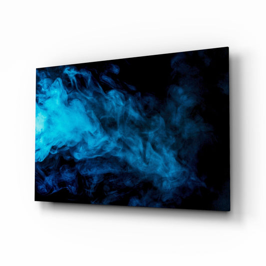 Angled perspective view of a glass wall art panel displaying swirling blue smoke patterns against a black background.