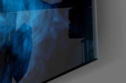 Blue smoke glass wall art panel displayed at an angle, showing deep blue swirling patterns with black silhouettes against white background.