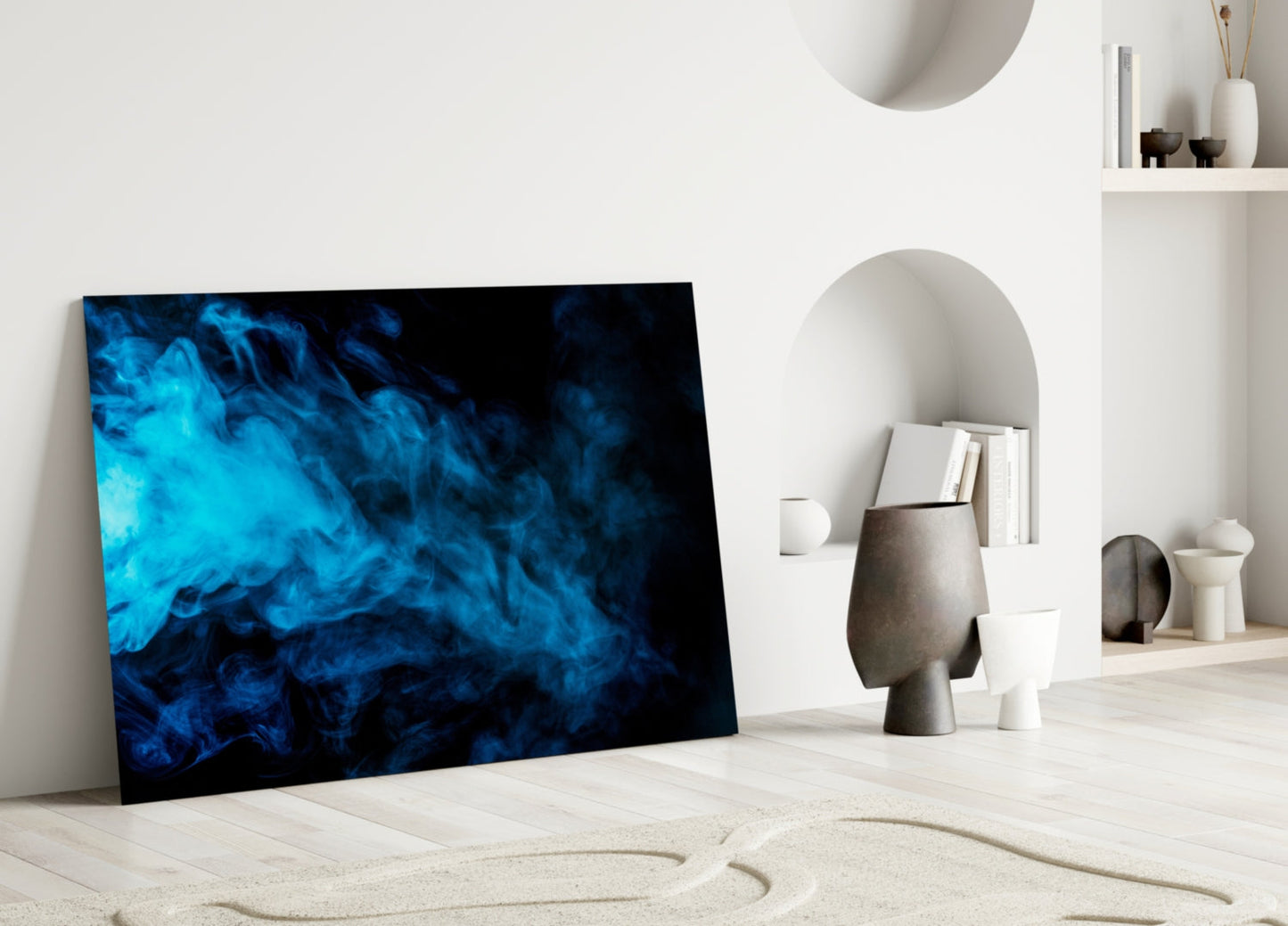 Blue Smoke Glass Wall Art leaning against white wall in minimalist interior with shelving and decorative objects.