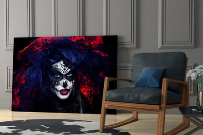 Glass wall art depicting woman with skeletal face paint, red and blue hair, displayed in modern living room beside wooden chair.
