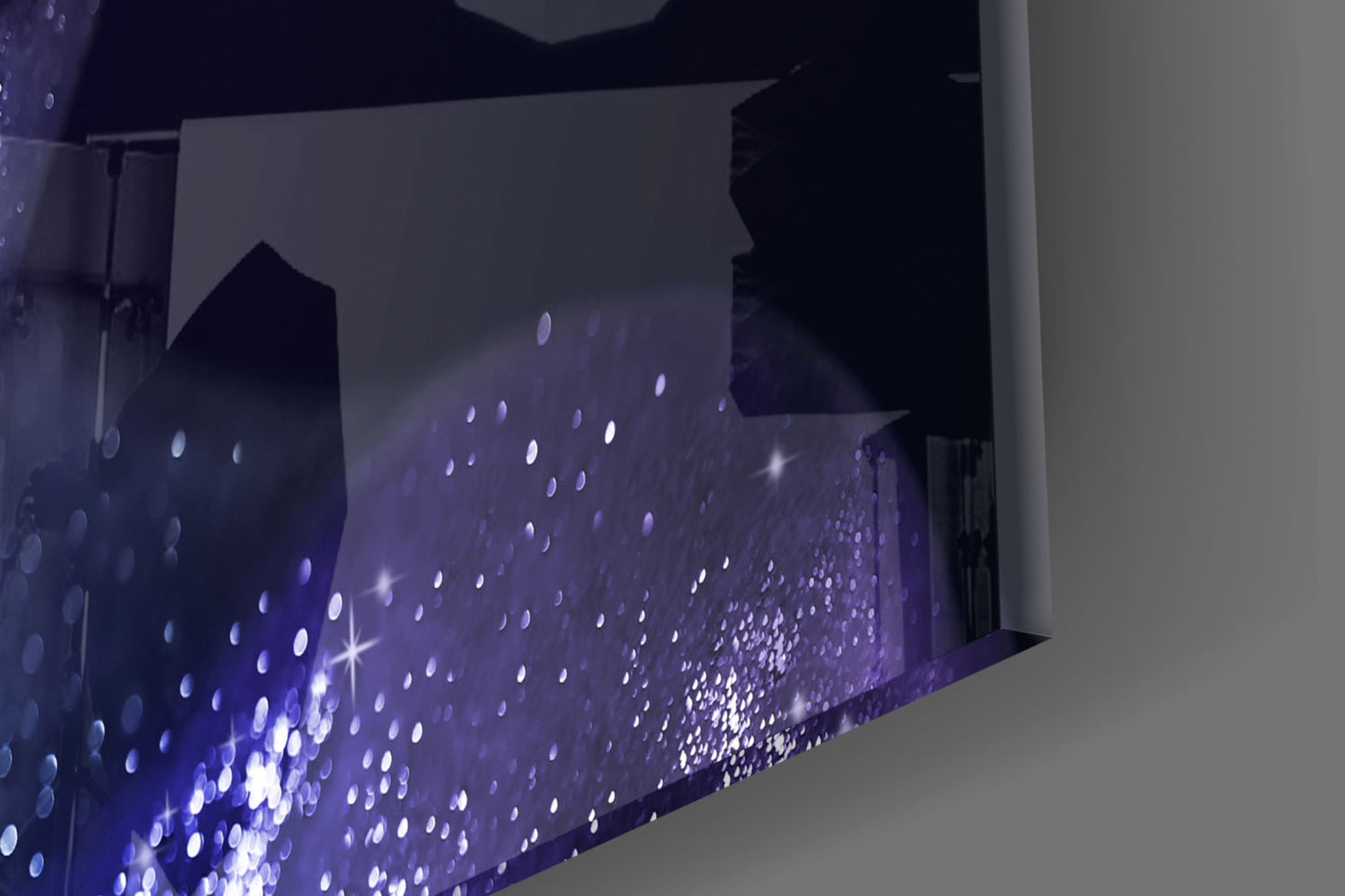 Close-up angle of purple glass wall art with white illuminated dots and sparkle effects against white wall.
