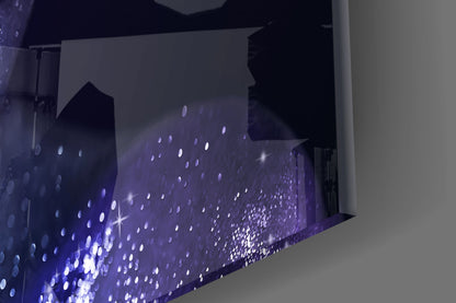 Close-up angle of purple glass wall art with white illuminated dots and sparkle effects against white wall.