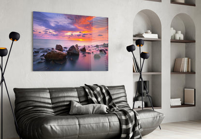 Sunset at Sea glass wall art displayed above a black leather sofa in a modern living room interior.