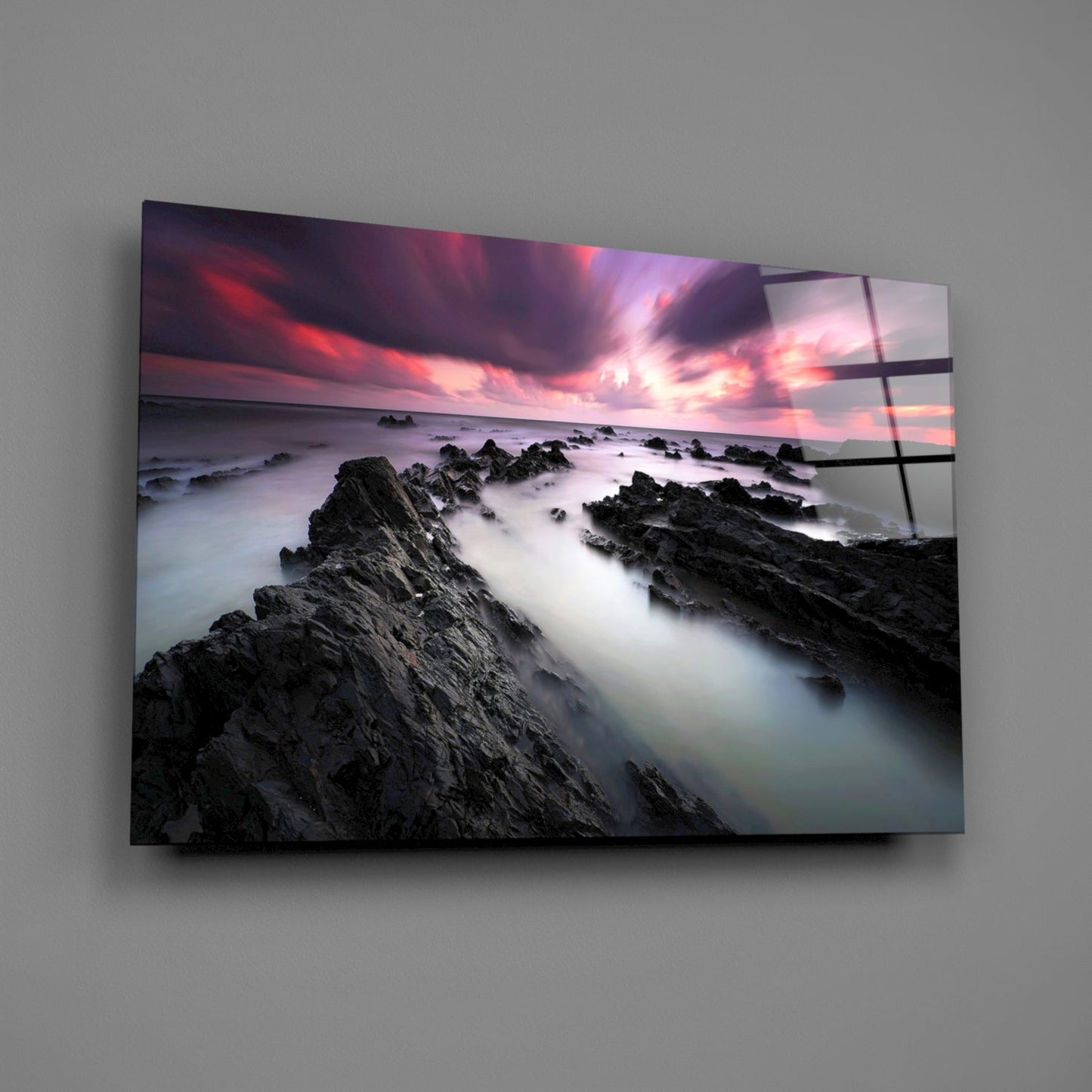 Crimson Sky Over Black Rocks Glass Wall Art