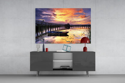 Rowboat by Pier Under Fiery Clouds Glass Wall Art