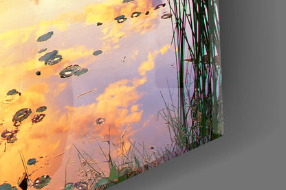 Rowboat by Pier Under Fiery Clouds Glass Wall Art