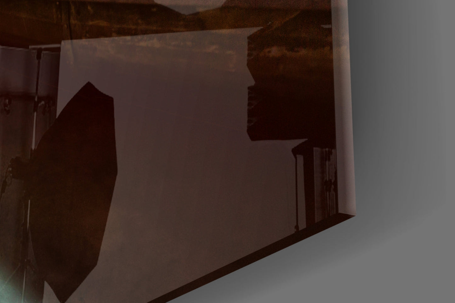 Silhouetted kayak and sunset scene visible through frosted glass wall art panel, backlit display view.