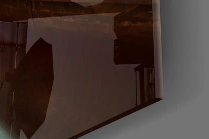 Silhouetted kayak and sunset scene visible through frosted glass wall art panel, backlit display view.