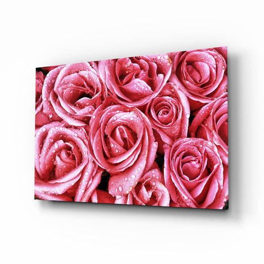 Close-up of densely packed pink and red roses covered in water droplets, displayed as a glass wall art panel with shadow effect.