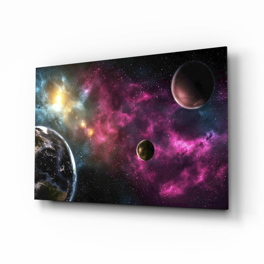 Angled perspective view of glass wall art featuring a planet, nebula clouds in magenta and purple, stars, and a glowing star cluster against black space background.