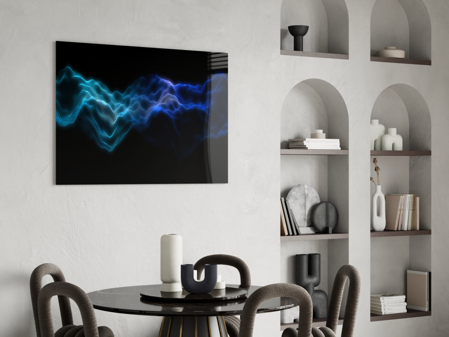 Modern dining room interior with Rhythmic Fog glass wall art displaying glowing blue wave patterns above round black table and curved gray chairs.