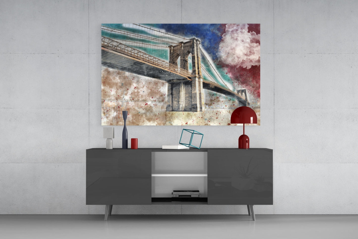 Colorful glass wall art depicting Brooklyn Bridge displayed above dark gray media console with red and blue decorative accessories.