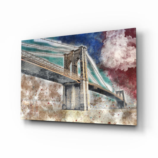 Glass wall art panel displaying a Brooklyn Bridge illustration with watercolor splashes in turquoise, burgundy, and cream tones.
