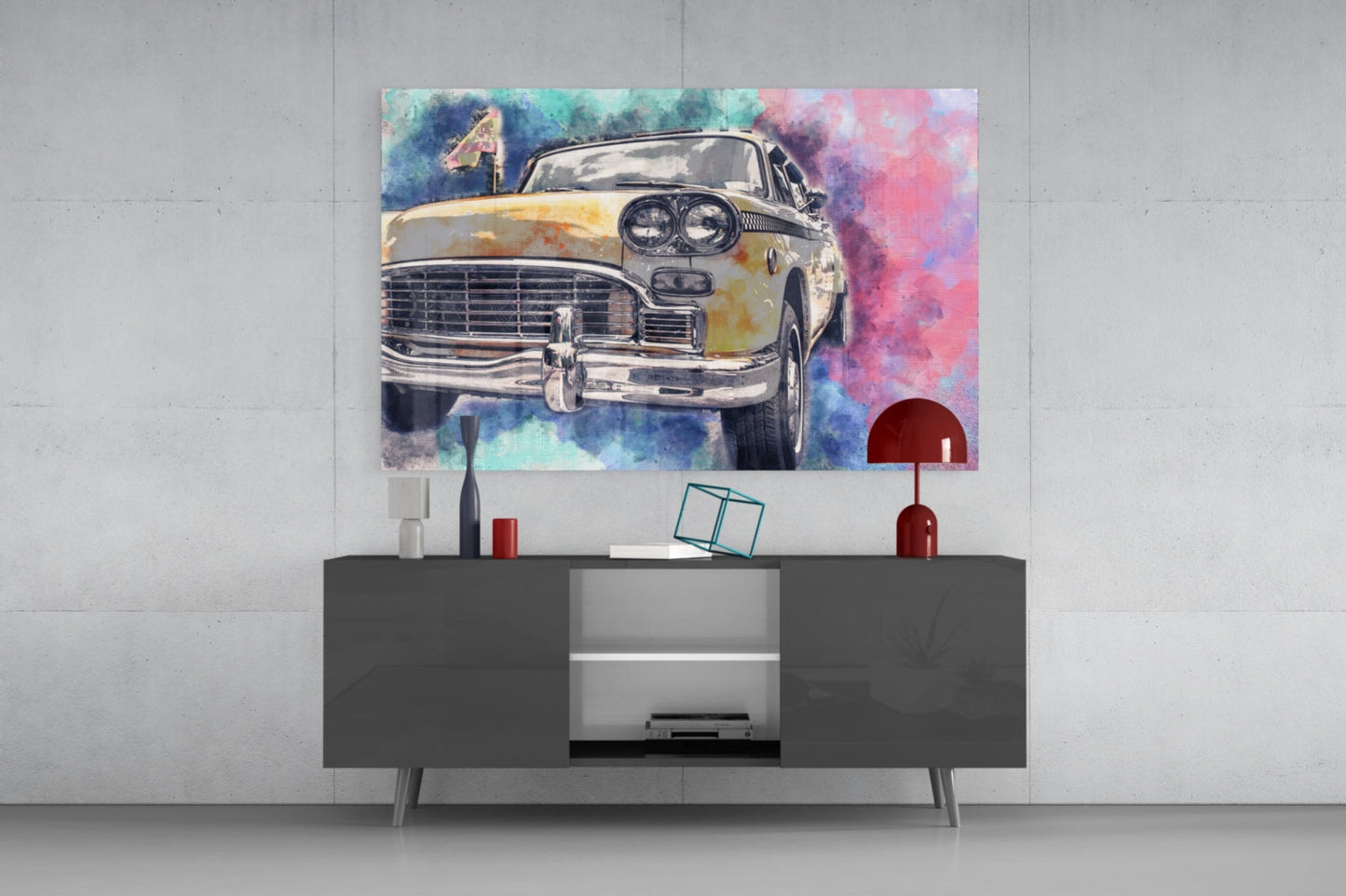 Colorful watercolor taxi illustration displayed on glass wall art above a dark modern console table in a minimalist interior setting.