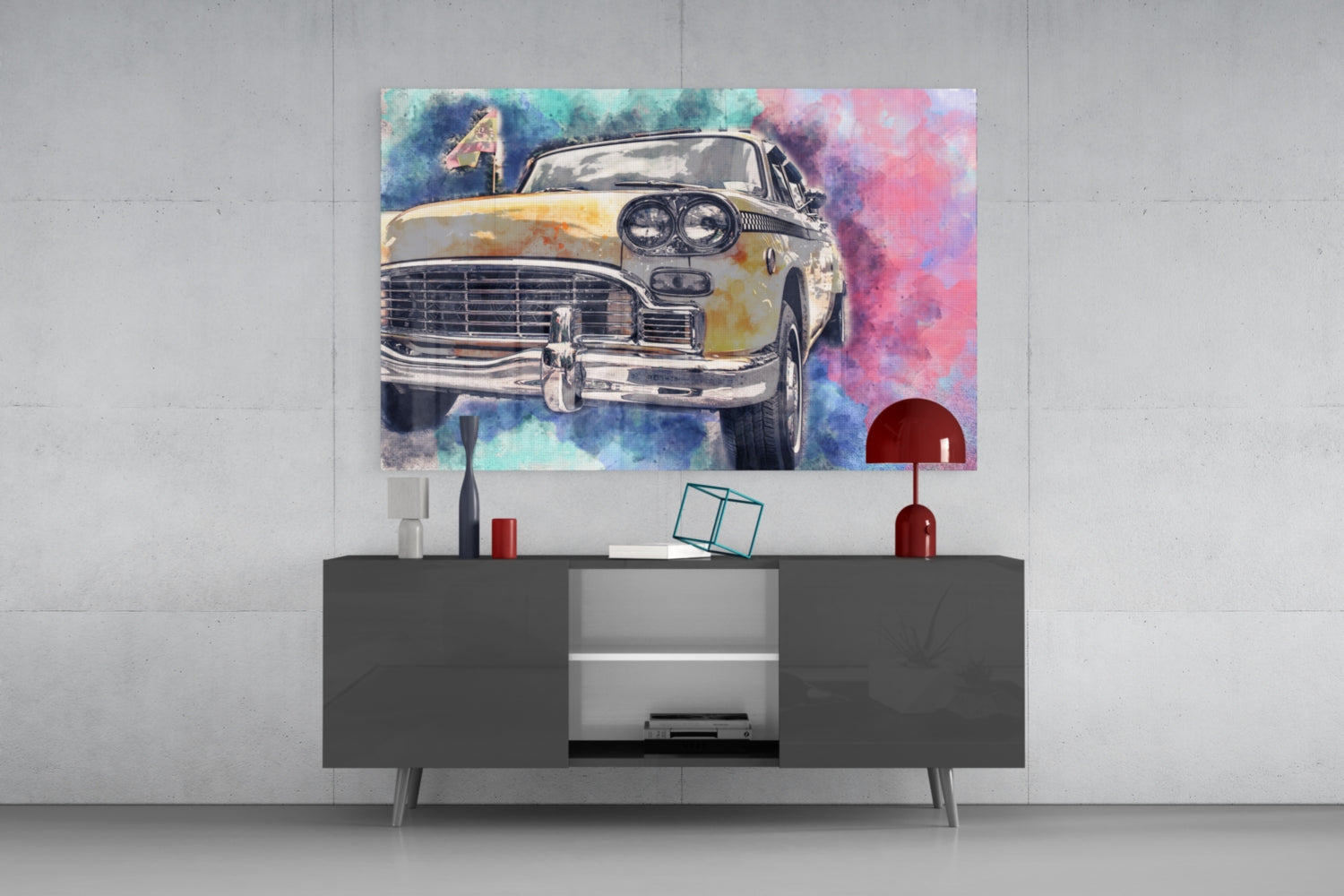 Colorful watercolor taxi illustration displayed on glass wall art above a dark modern console table in a minimalist interior setting.