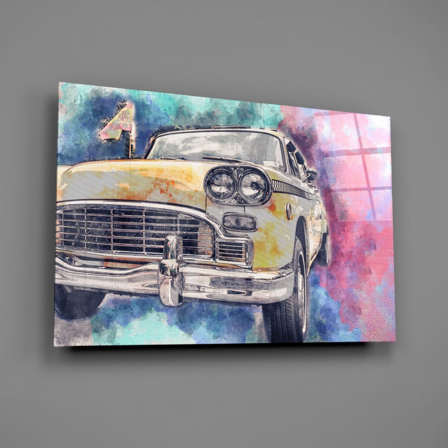 Angled view of a glass wall art panel displaying a vintage taxi car with dual headlights against a watercolor background in pink, blue, and yellow tones.
