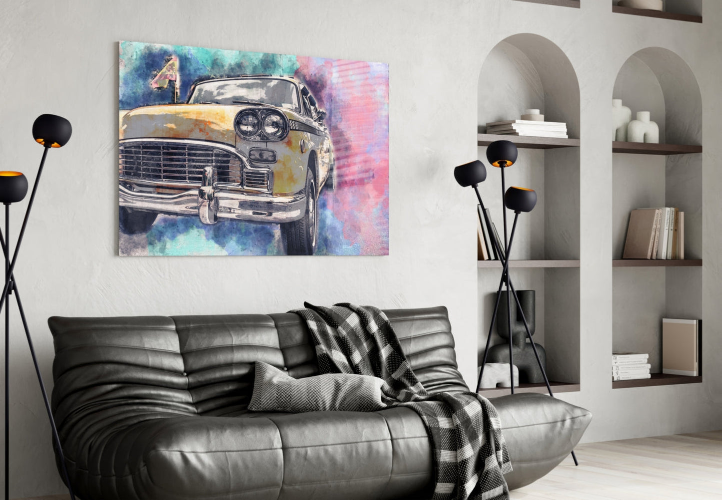 Colorful watercolor taxi illustration with blue, pink, and yellow tones displayed on wall above black leather sofa in modern living room.
