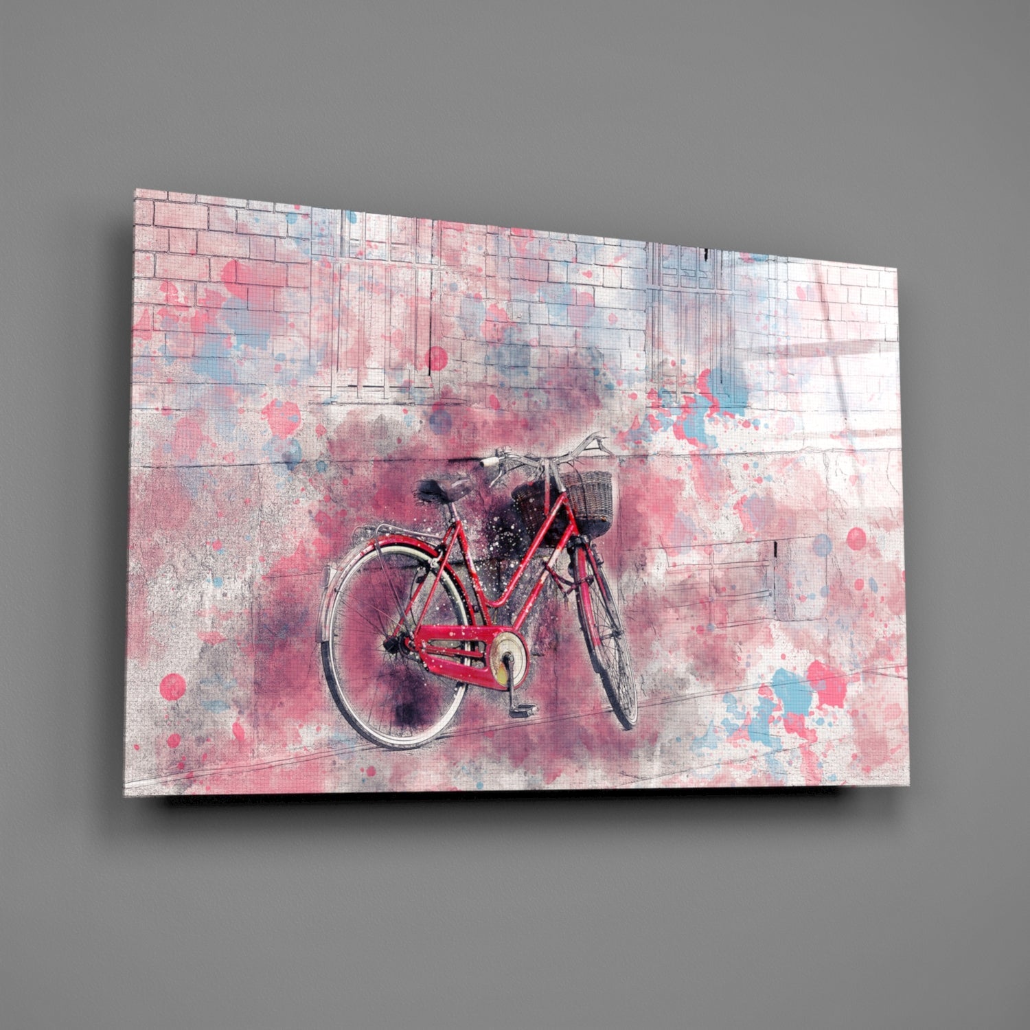 Red bicycle centered on pink and blue watercolor-splattered glass panel mounted on gray wall.