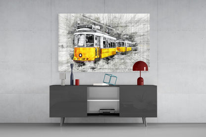 Yellow tram glass wall art displayed above dark gray media console in modern living room interior.