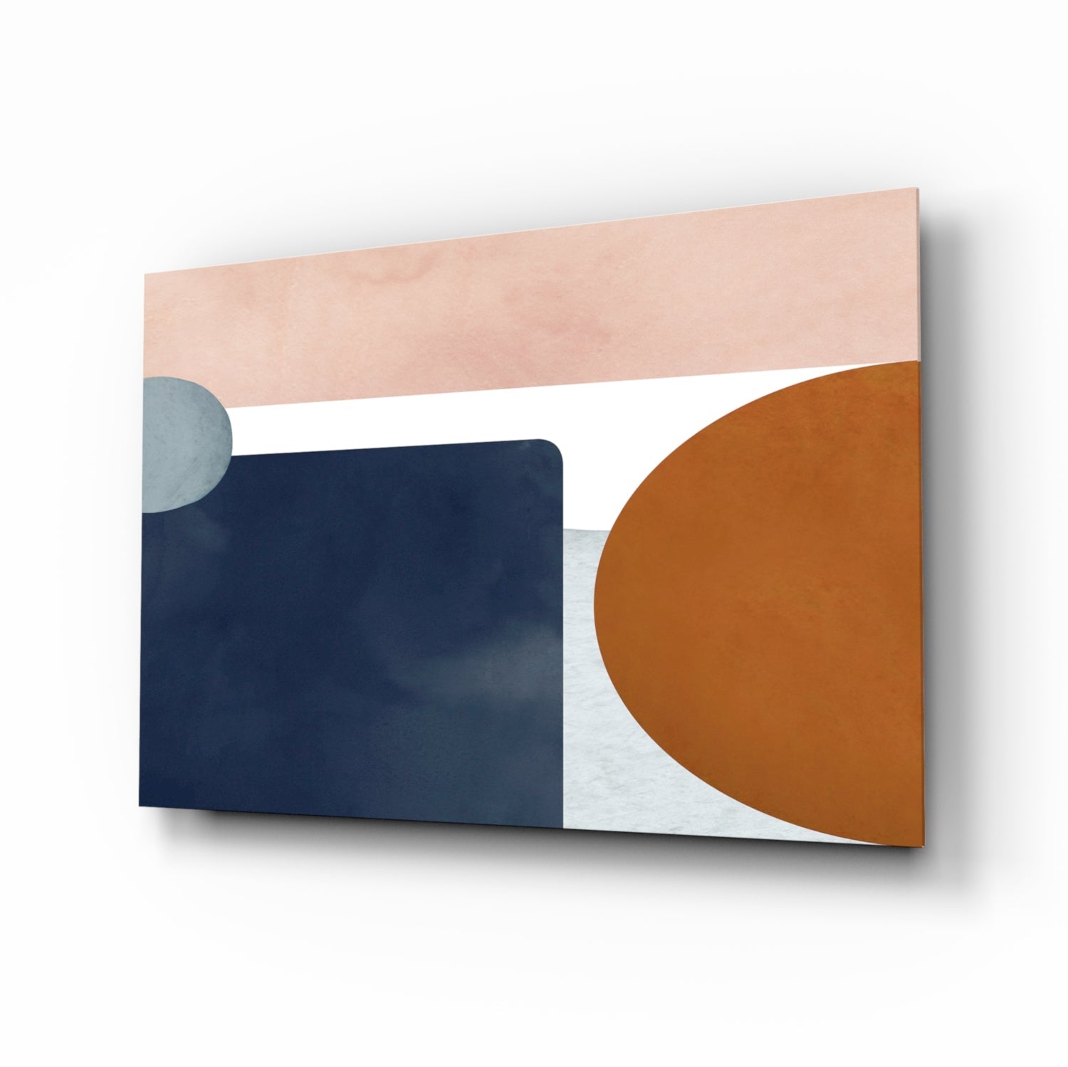 Abstract glass wall art featuring geometric shapes in peach, navy blue, white, and terracotta, displayed at an angled perspective.