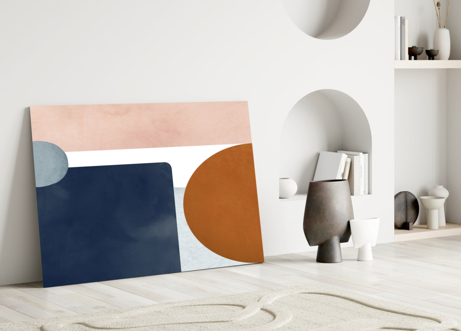 Copenhagen Glass Wall Art leaning against white wall, featuring abstract geometric shapes in navy, peach, terracotta, and light blue.