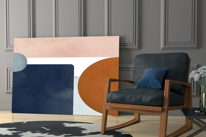 Copenhagen Glass Wall Art displaying geometric shapes in navy, terracotta, and blush tones mounted above wooden chair in modern interior.