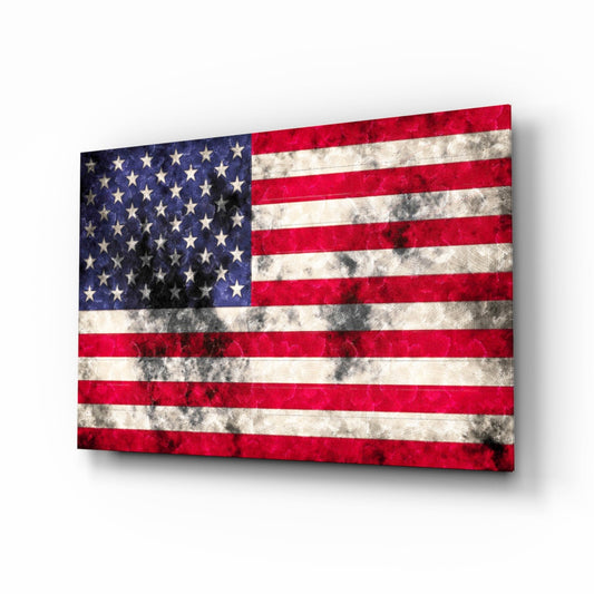 Distressed American flag glass wall art panel displayed at an angle, showing worn red and white stripes with blue star-filled canton.