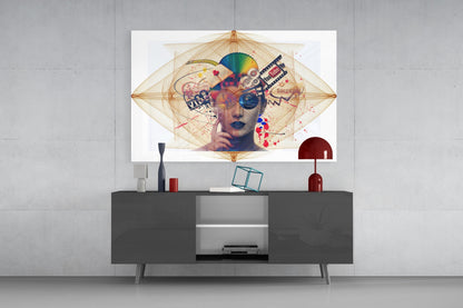 Modern living room with dark media console displaying abstract glass wall art featuring a colorful portrait with geometric patterns and splashes above.