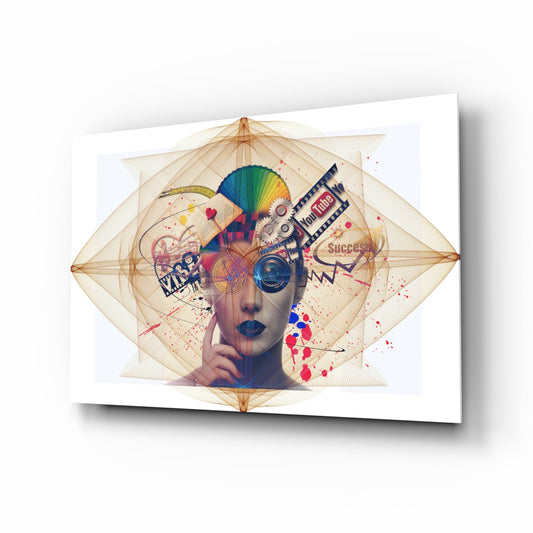 Glass wall art displaying a stylized female head with colorful geometric overlays, gears, and splattered paint effects on white background.