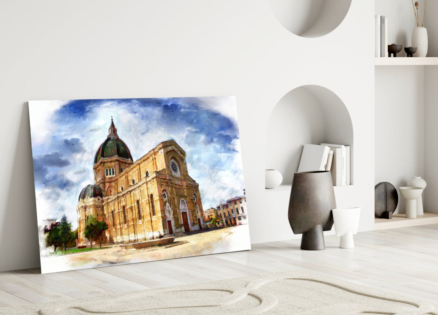 Glass wall art leaning against white wall displays watercolor painting of golden cathedral with dome under blue sky.