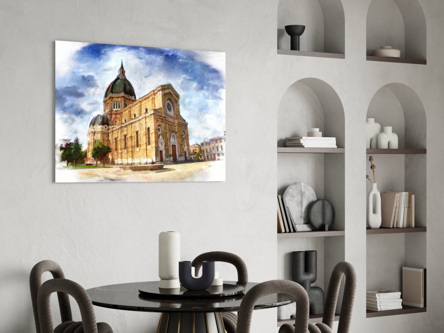 Glass wall art depicting a golden-domed cathedral with blue sky, displayed above a black dining table in a modern interior.
