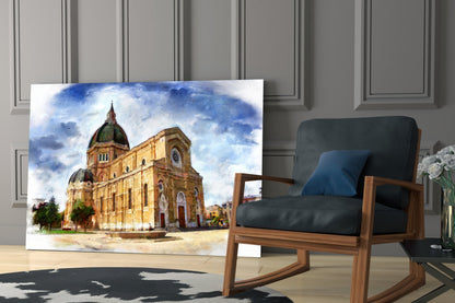 Glass wall art displaying a watercolor painting of a golden cathedral with green domes against a blue sky, displayed in modern living room setting.