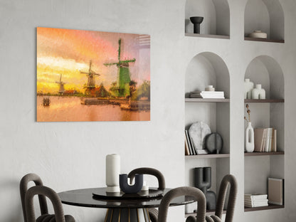 Windmills glass wall art hung above a black dining table, showing a sunset landscape with sailing ships and green windmill in warm golden and orange tones.
