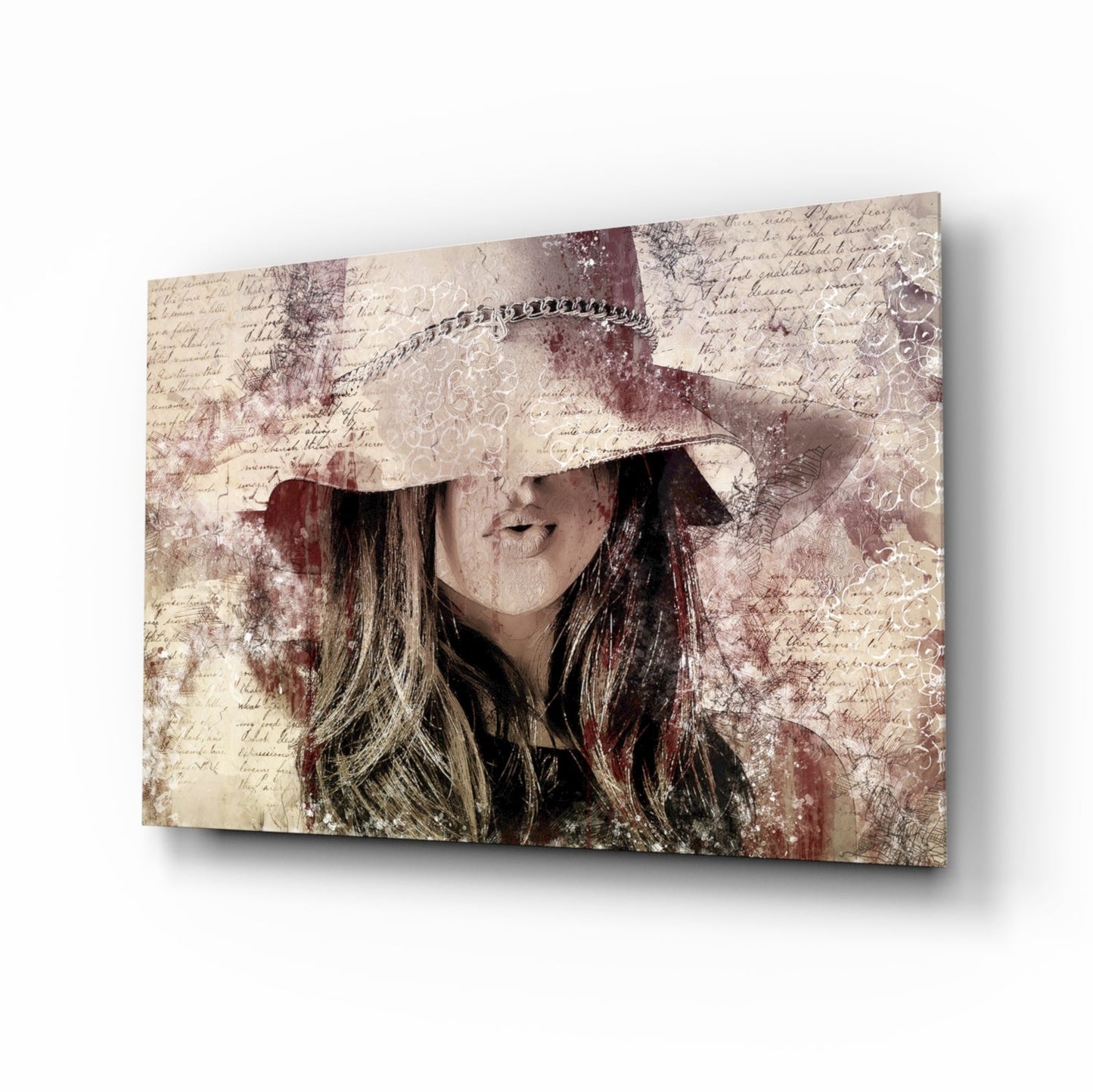 Angled view of glass wall art featuring a woman wearing a cream cowboy hat with long dark hair, overlaid on vintage handwritten text and burgundy distressed patterns.