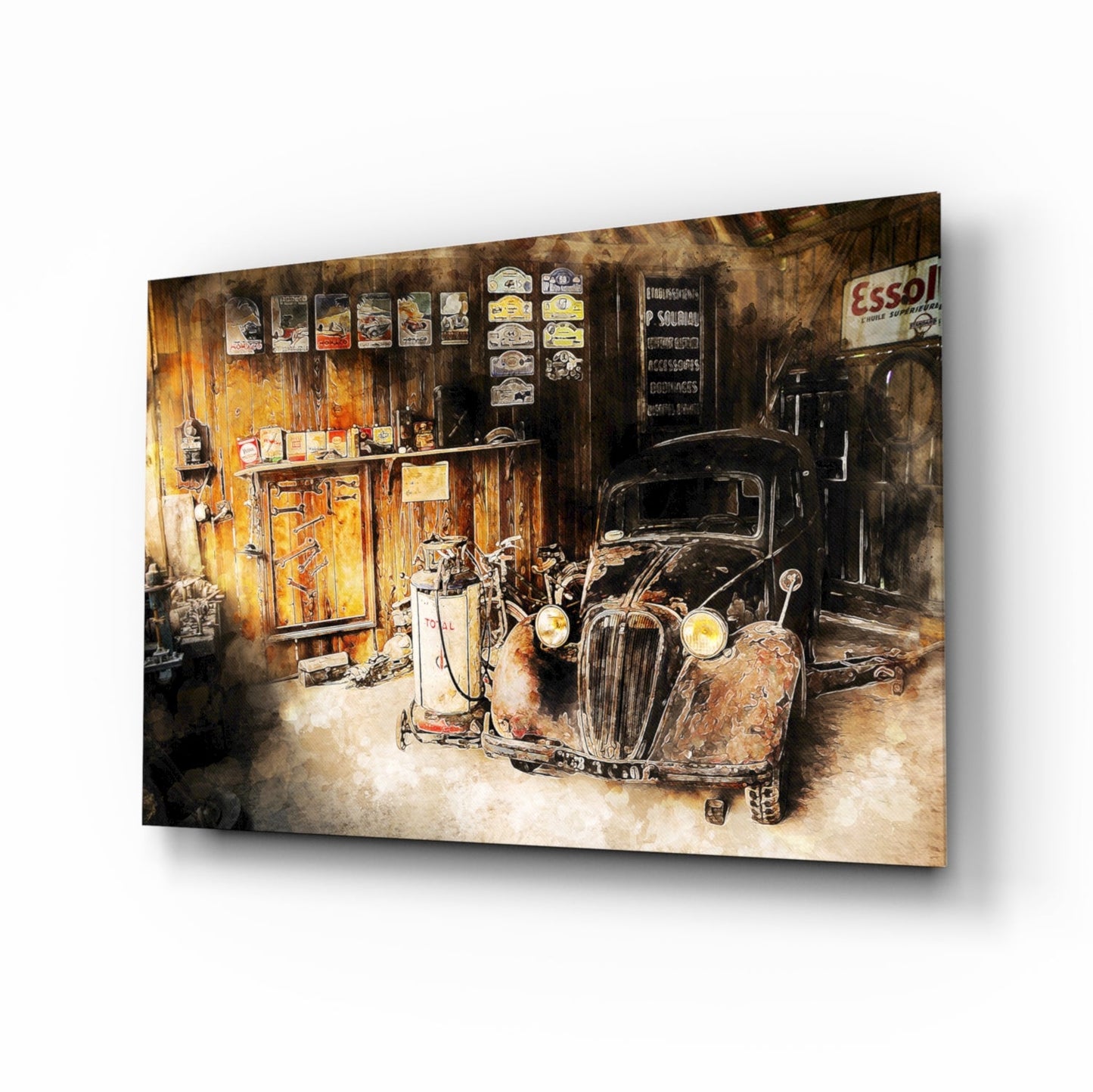 Angled product view of glass wall art depicting a vintage garage interior with rusted car, yellow gas pump, and weathered wooden walls with Esso signage.