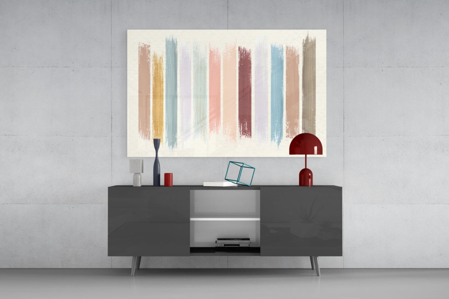 Modern living room interior with colorful vertical brush stroke glass art displayed above dark gray media console with red lamp and decorative accessories.