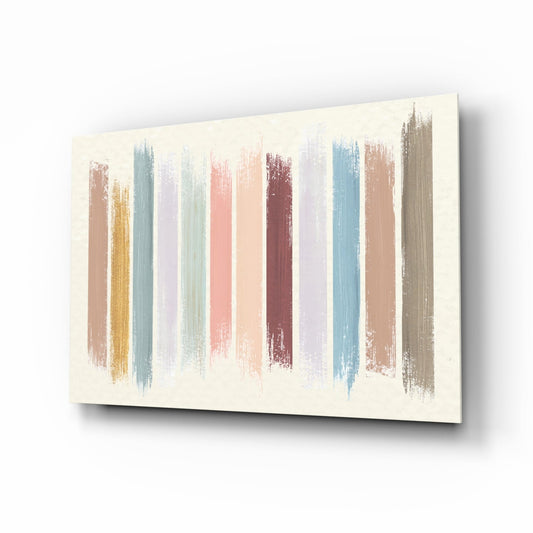 Glass wall art panel displaying vertical brushstrokes in muted pastel colors including blue, pink, taupe, and burgundy on cream background, shown at angle.