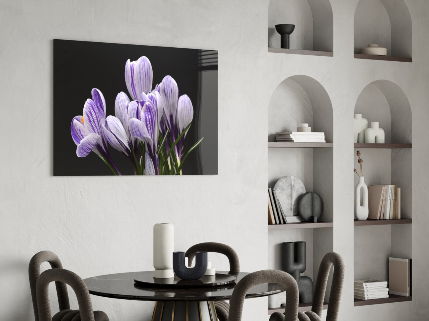 Purple crocus flowers on black background glass art displayed above black dining table in modern interior.