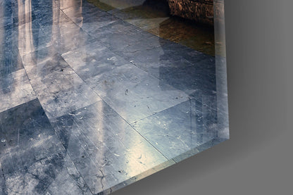 Close-up of slate tile flooring with natural grain patterns and weathered surface texture in gray and blue tones.