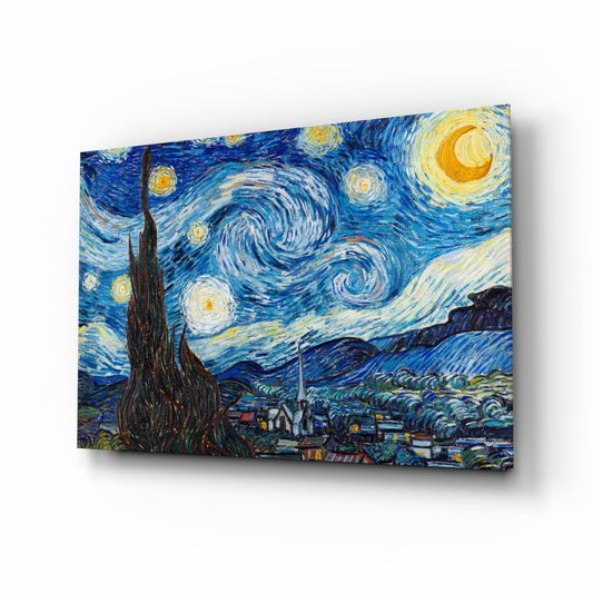 Glass wall art print of Van Gogh's Starry Night displayed at an angle, showing swirling blue sky, yellow stars, crescent moon, and dark cypress tree above a village.