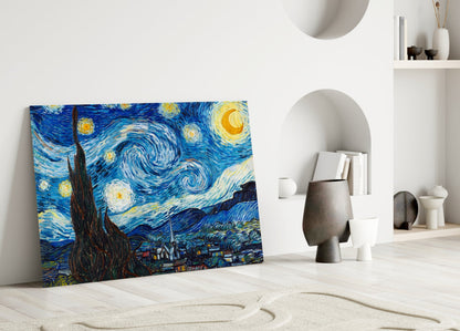 Van Gogh's Starry Night glass art leaning against white wall beside decorative ceramic vessels and shelving.