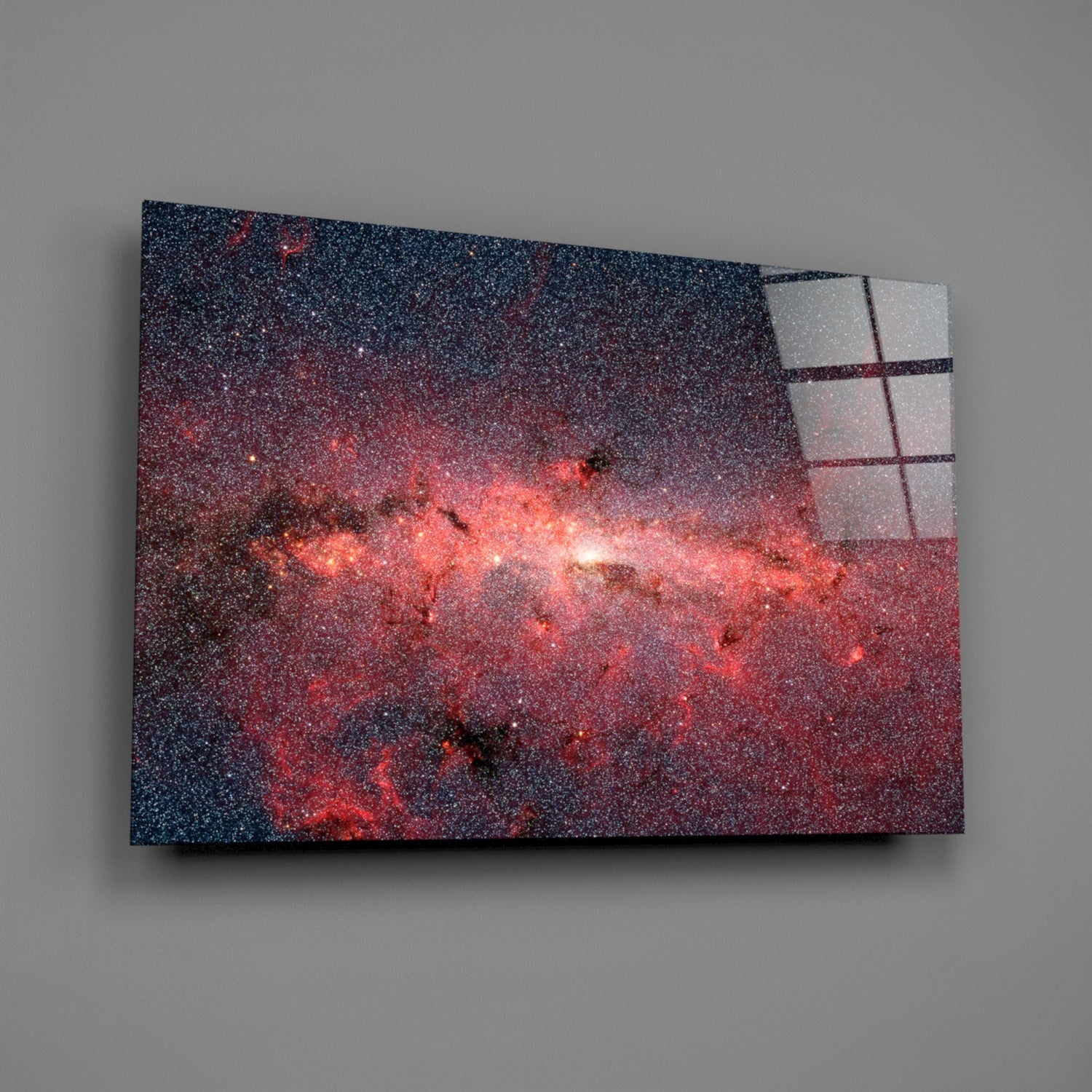 Red Nebula Glass Wall Art displayed at an angle, showing a textured glass panel with red and dark blue cosmic imagery and a grid pattern overlay on the right edge.